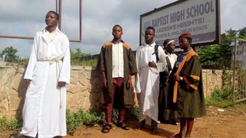 Christian students wore religious clothes over their school uniforms