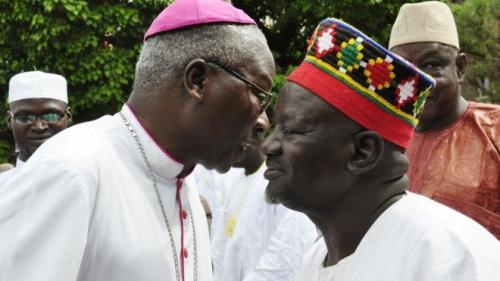 The Archbishop of Ouagadougou wishes a traditional chief a happy Eid